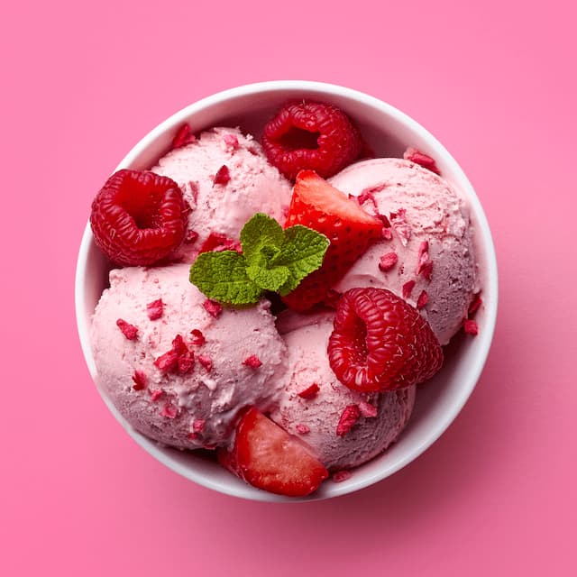 pink ice cream with raspberries