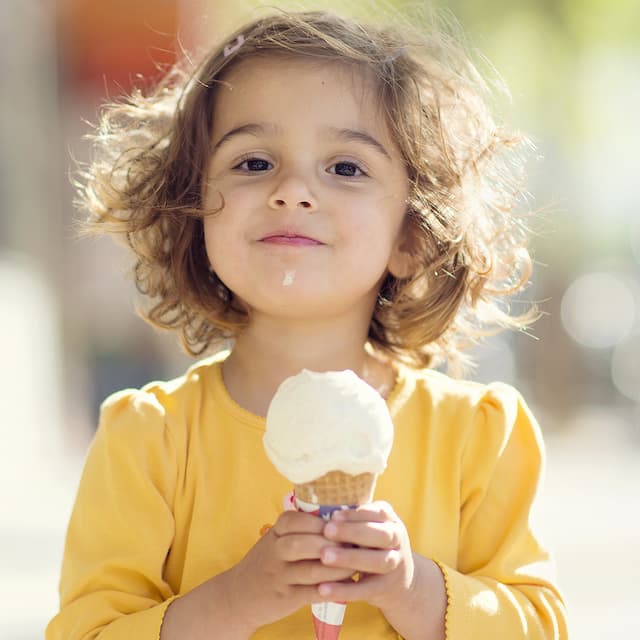 a little girl with icecream cone