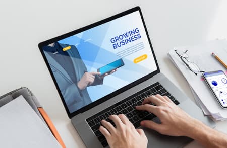 open laptop with hands