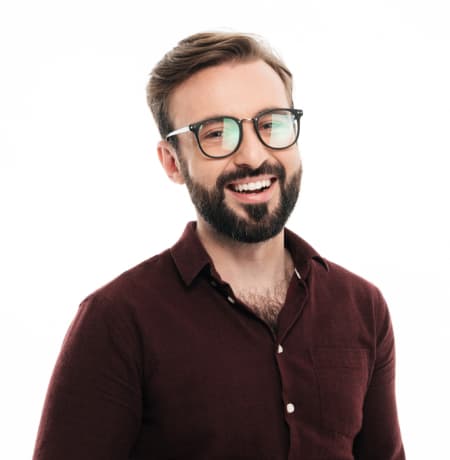 Man in glasses with a beard in a brown shirt
